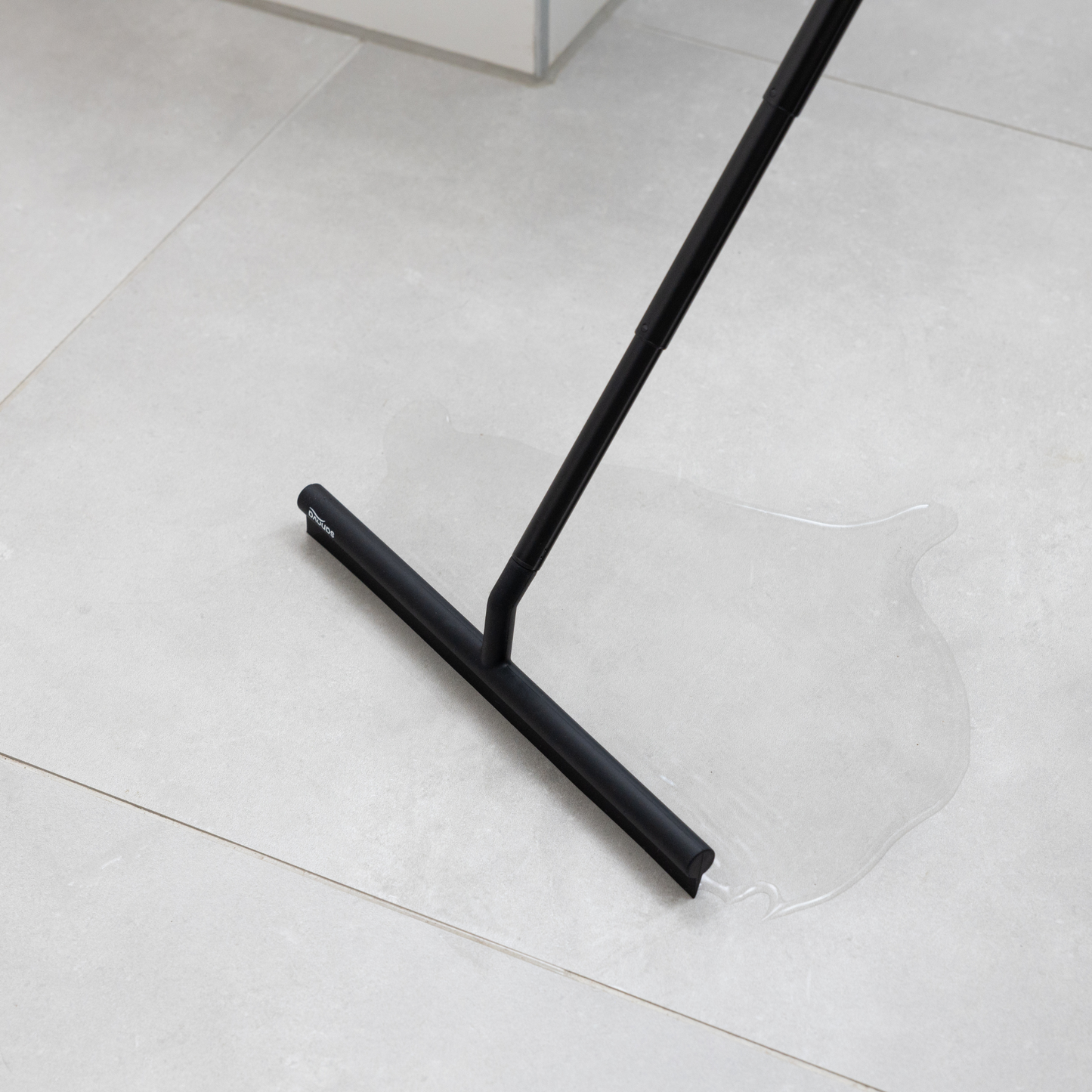 Raclette de douche extensible